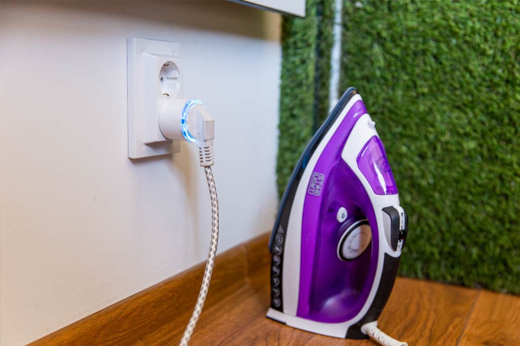 Shelly Plus Plug S with a plugged-in iron